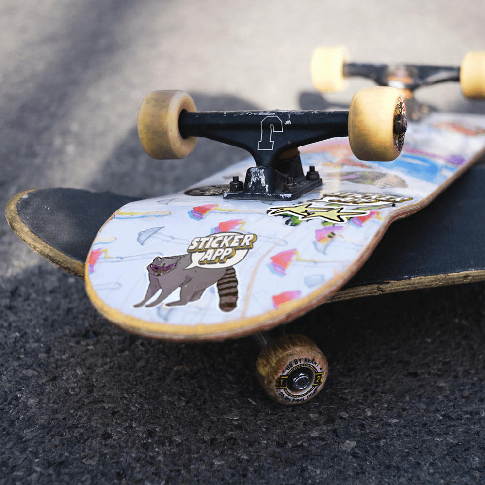 Cool stickers on the backside of a skateboard.