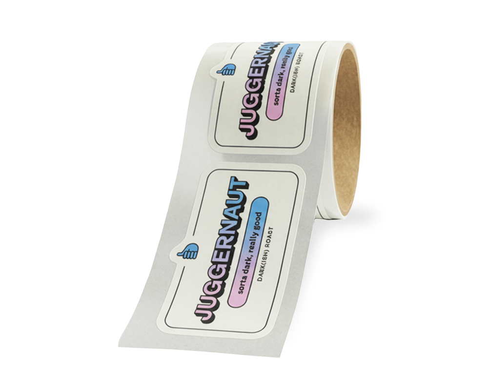 A roll of labels featuring the word "JUGGERNAUT" with thumbs up icons and phrases like "cool sticker, really good."