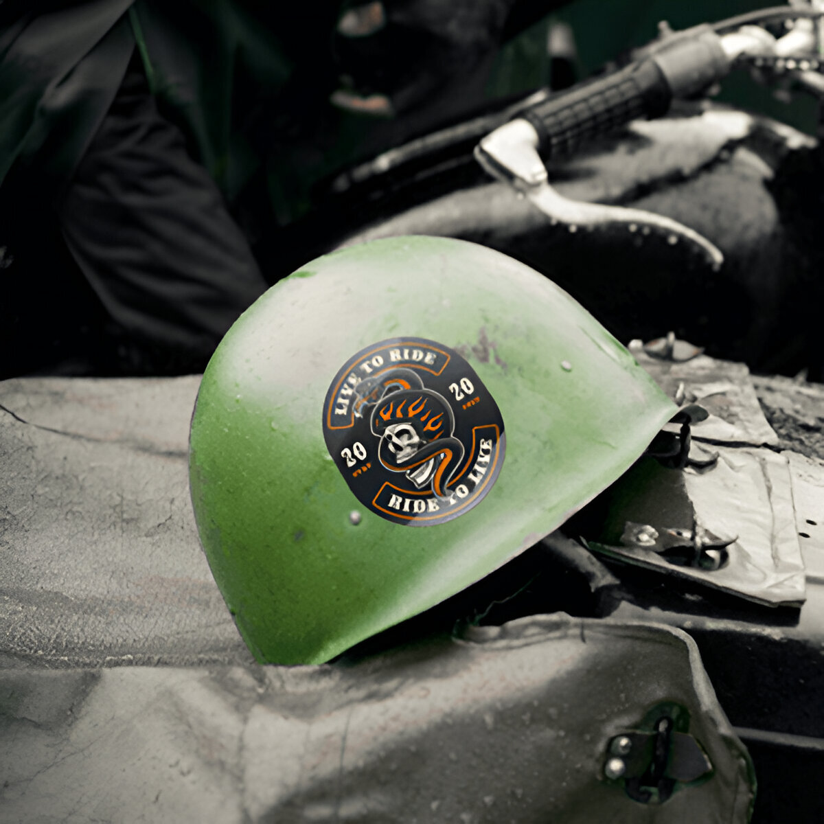 Sticker on green metallic hard hat helmet