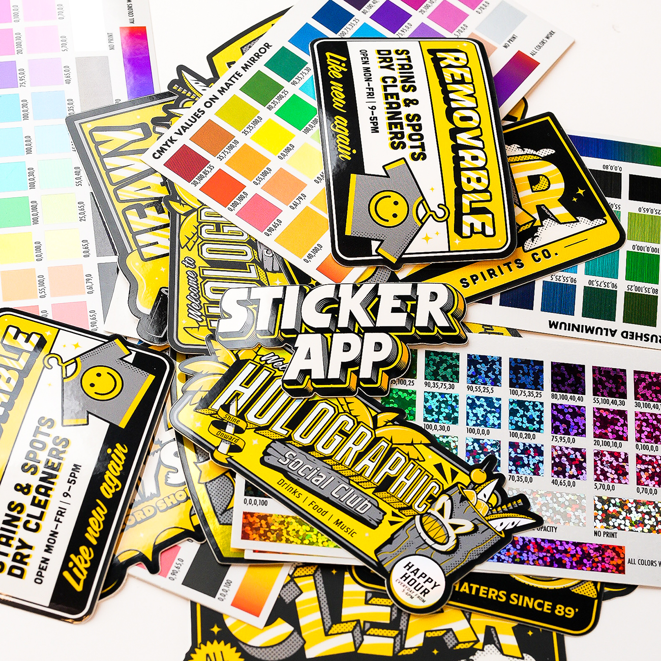 A colorful assortment of sticker samples and color swatches, featuring various designs and holographic elements.