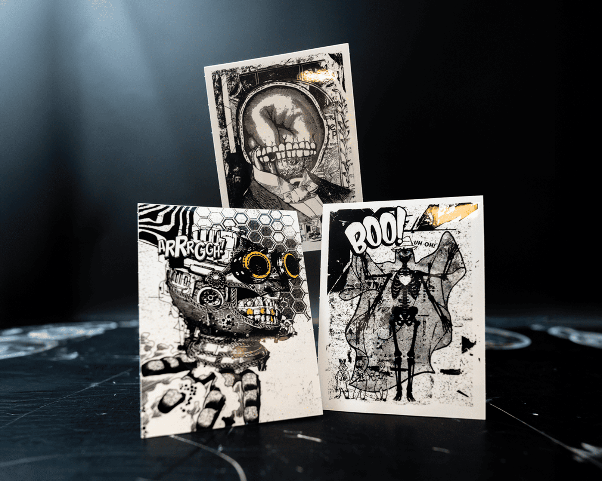 Three Halloween-themed vinyl stickers with abstract, spooky designs featuring skulls, skeletons, and comic-style text like "BOO!" and "ARRRGGH!"