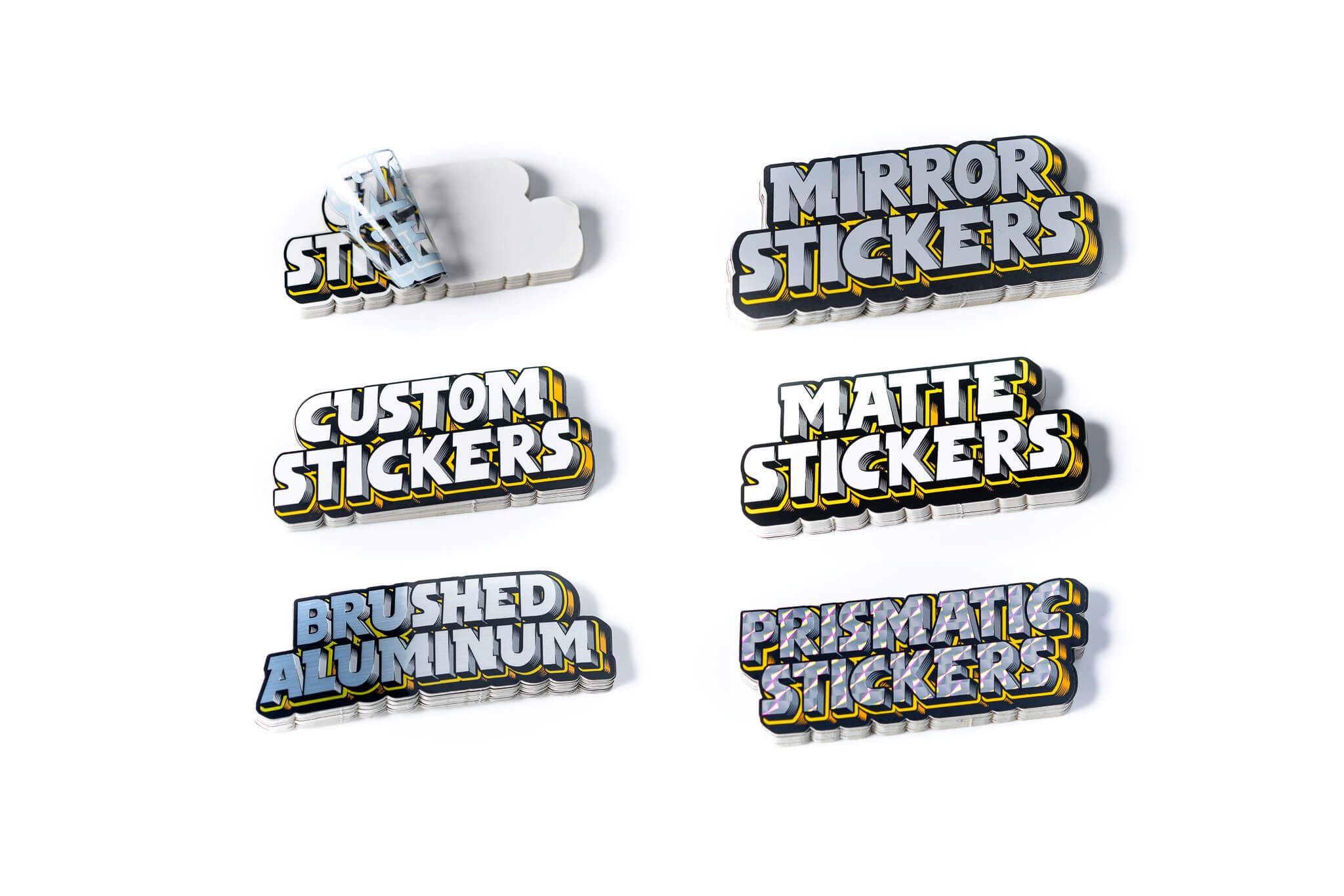 Zes stickers met teksten: "Mirror Stickers," "Custom Stickers," "Matte Stickers," "Brushed Aluminum," "Prismatic Stickers," en een onleesbare sticker.