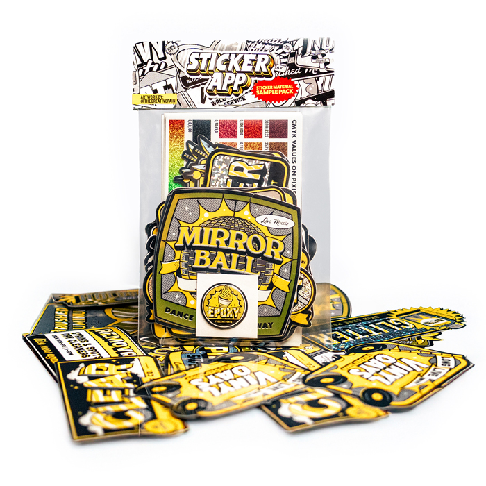 StickerApp sample pack met materialen rechtop, met sample stickers ervoor uitgespreid