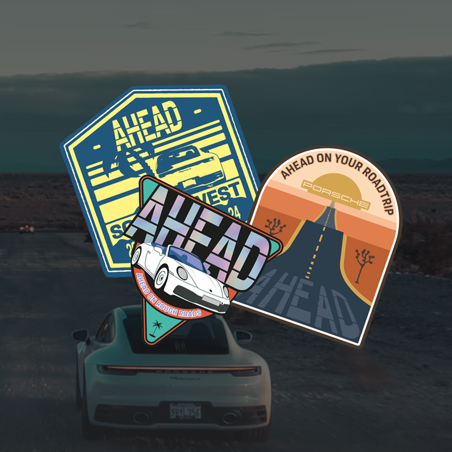 Three colorful car-themed stickers overlaid on a background of a porsche driving on a desert road.